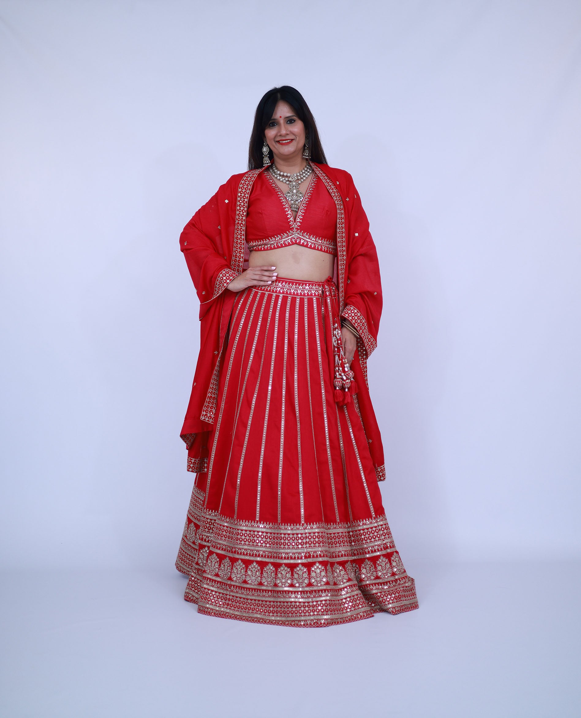 Red Lehenga with deep V neck blouse