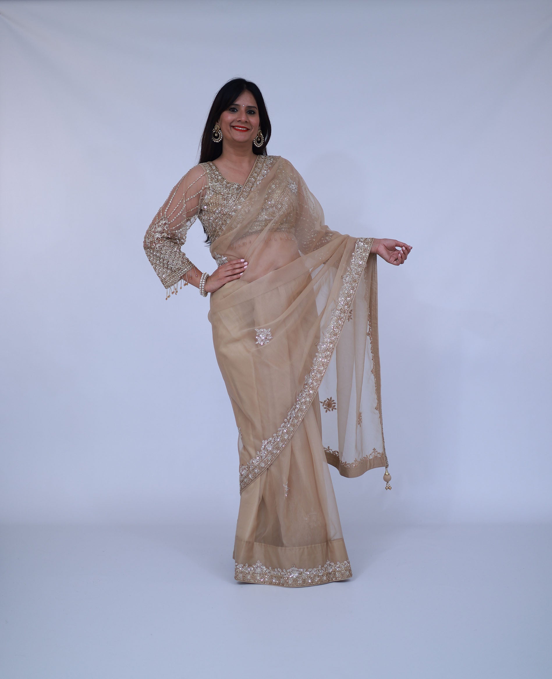 Beige organza saree with designer blouse