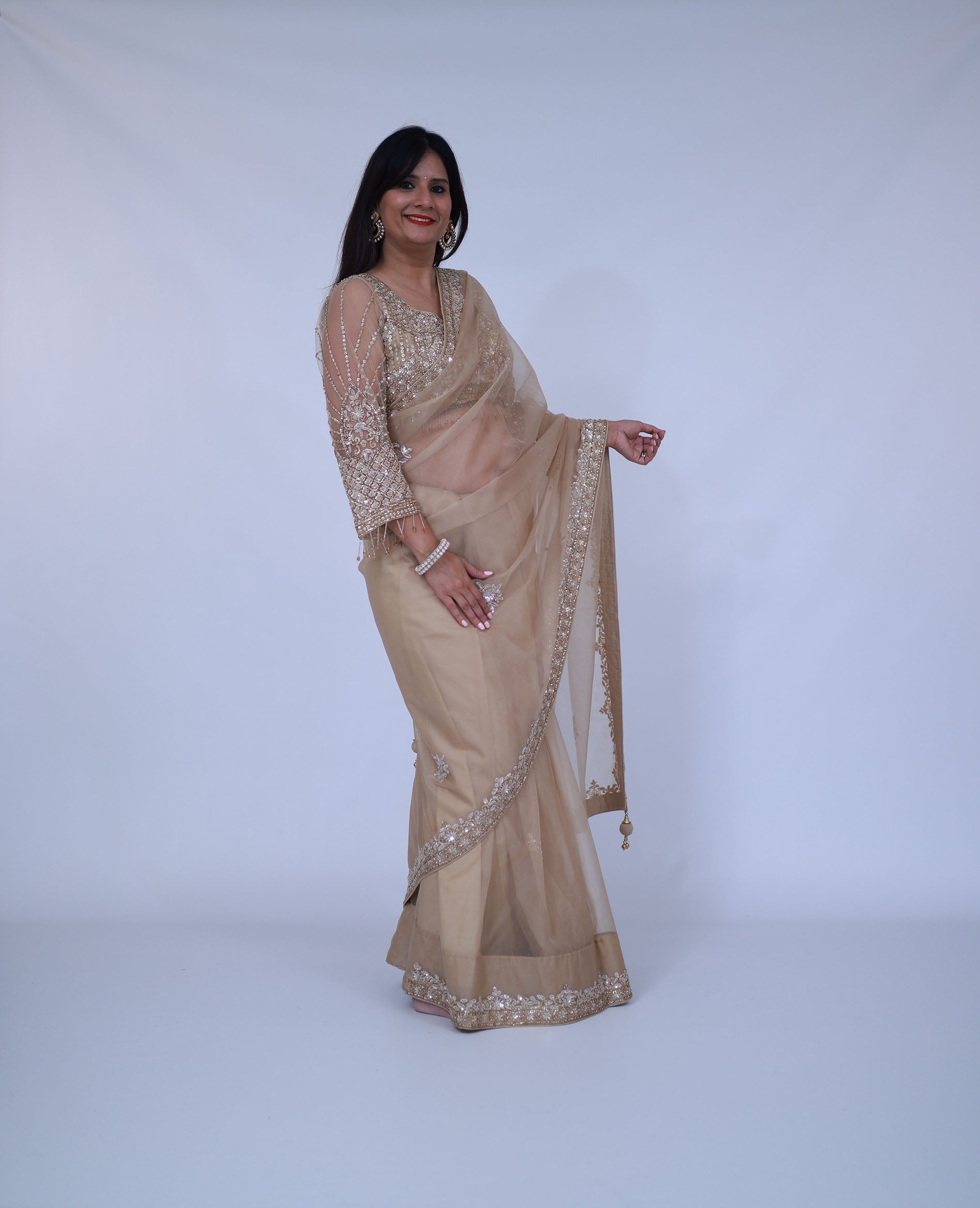 Beige organza saree with designer blouse