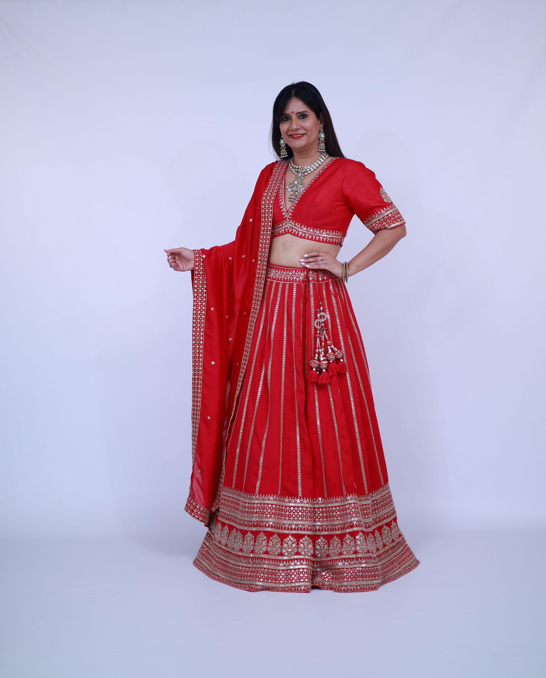 Red Lehenga with deep V neck blouse
