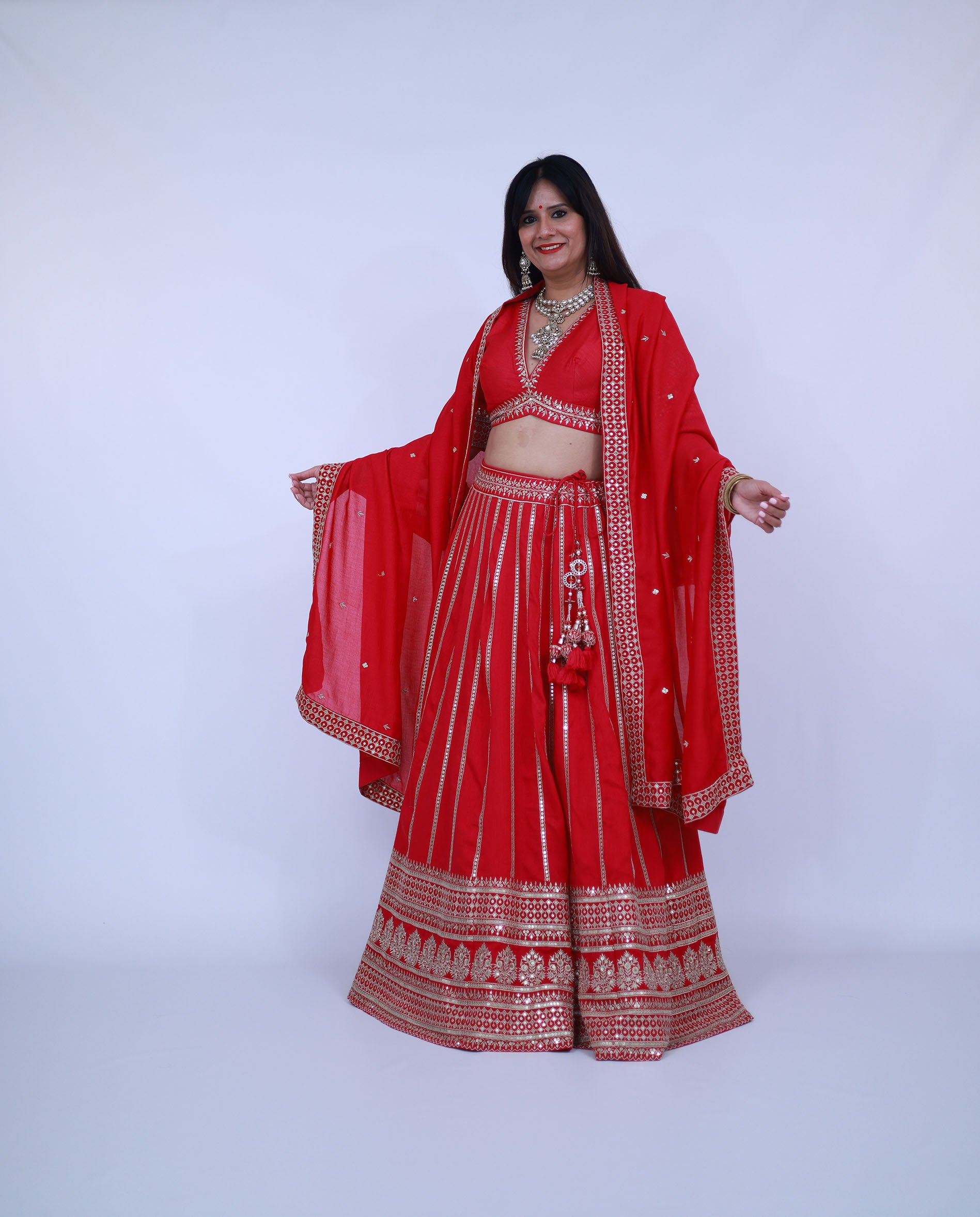 Red Lehenga with deep V neck blouse