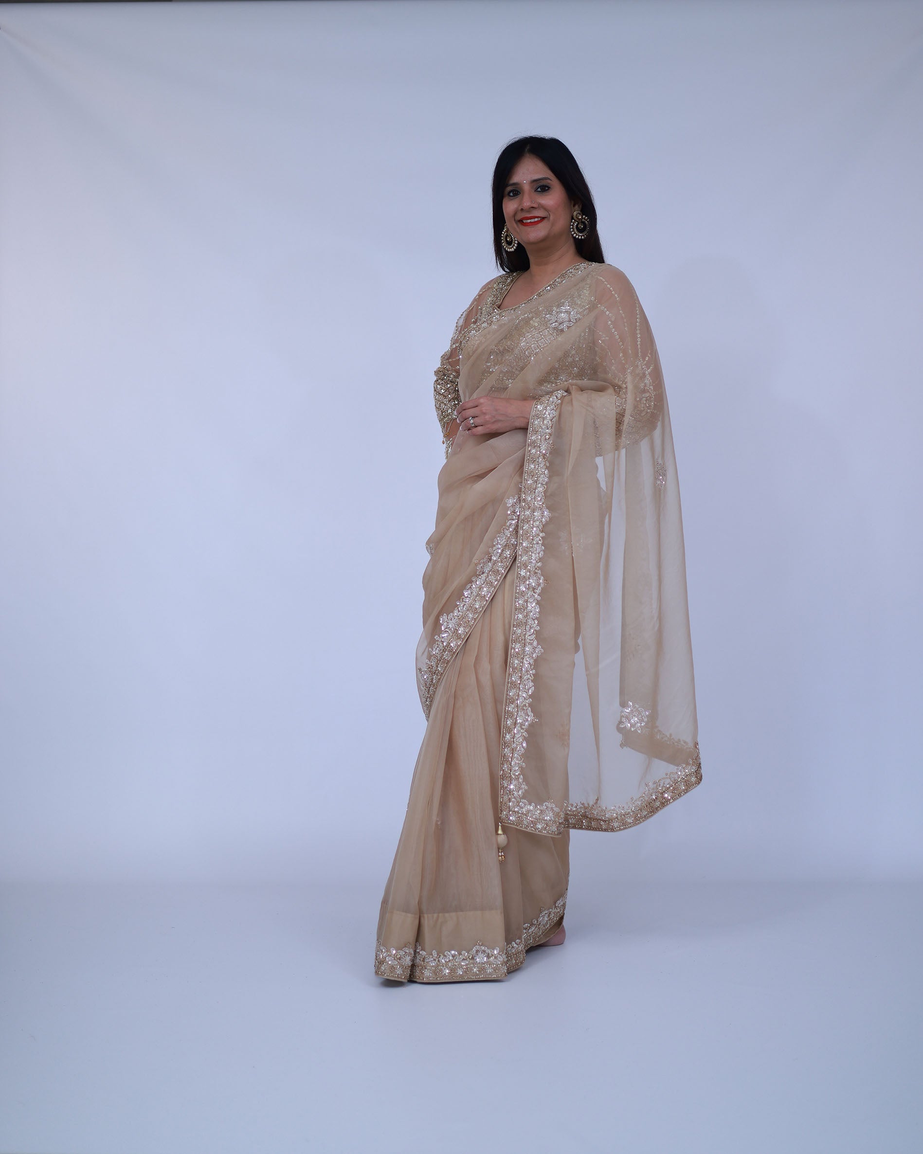Beige organza saree with designer blouse